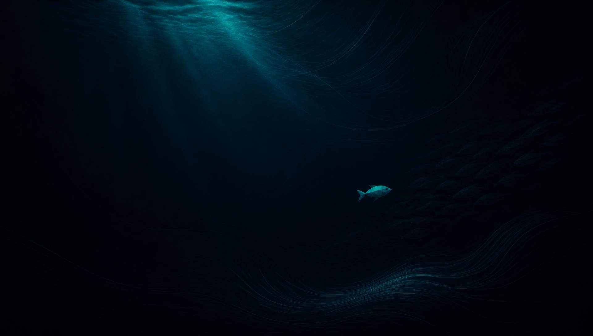 A single small fish swimming apart from the shoal in deep water
